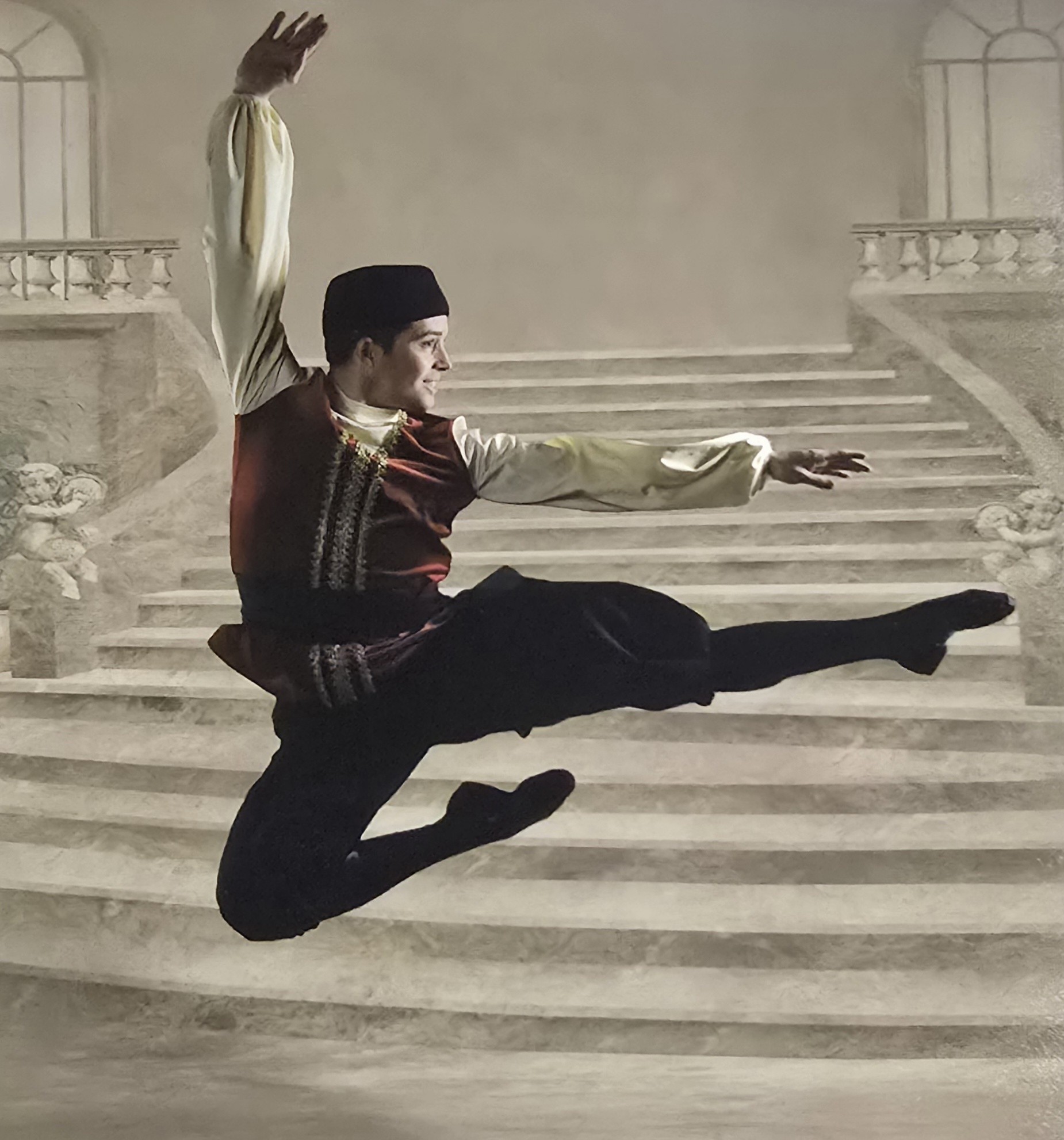 A still of a dancer jumping in a traditional Russian ballet costume.